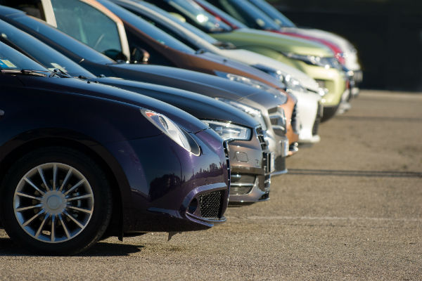 Uber cars lined up in a parking lot