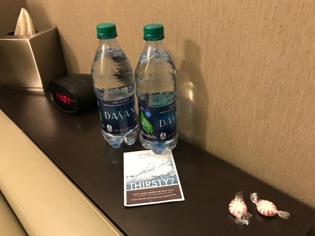 Minute Suites DFW Airport Room with Bottled Water and Snacks for Sale