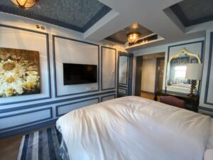 Hotel room with blue coffered ceiling and paneling