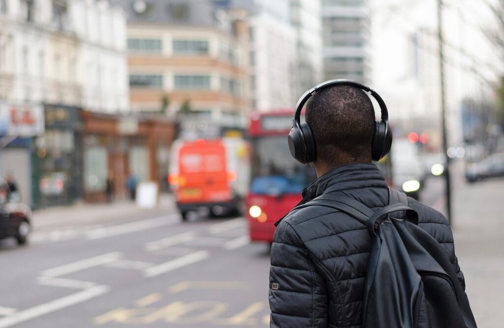 a man wearing headphones on his back