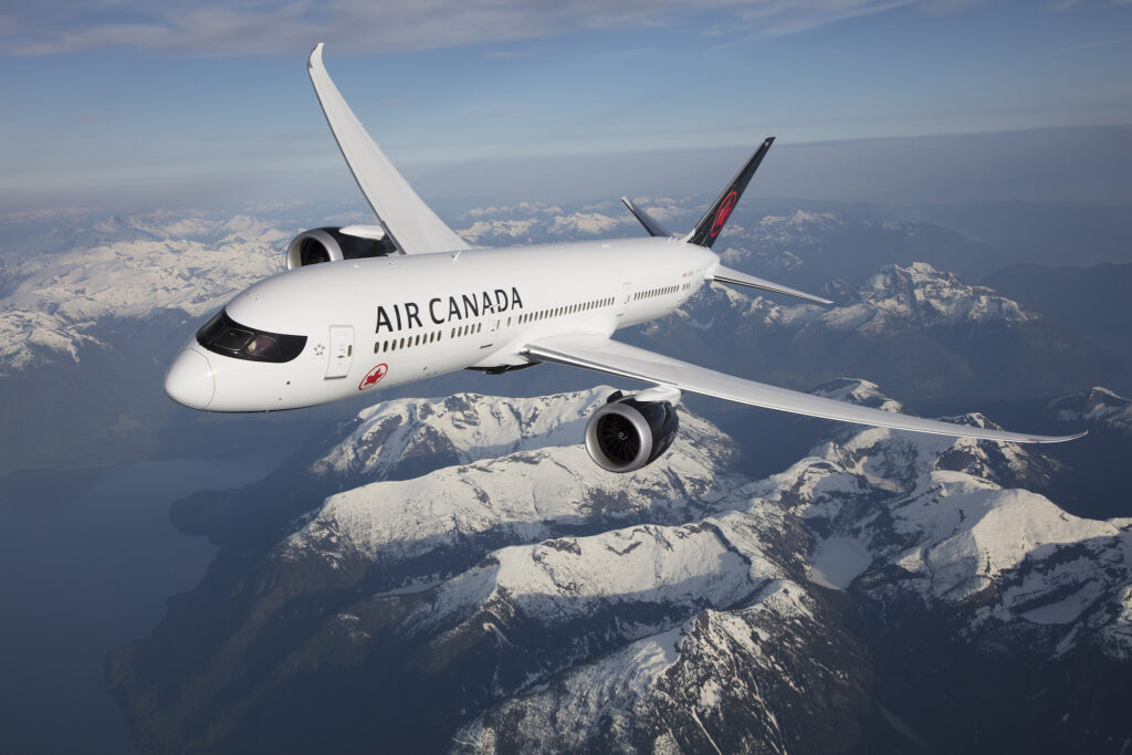 Air Canada plane flying over the Canadian Rockies